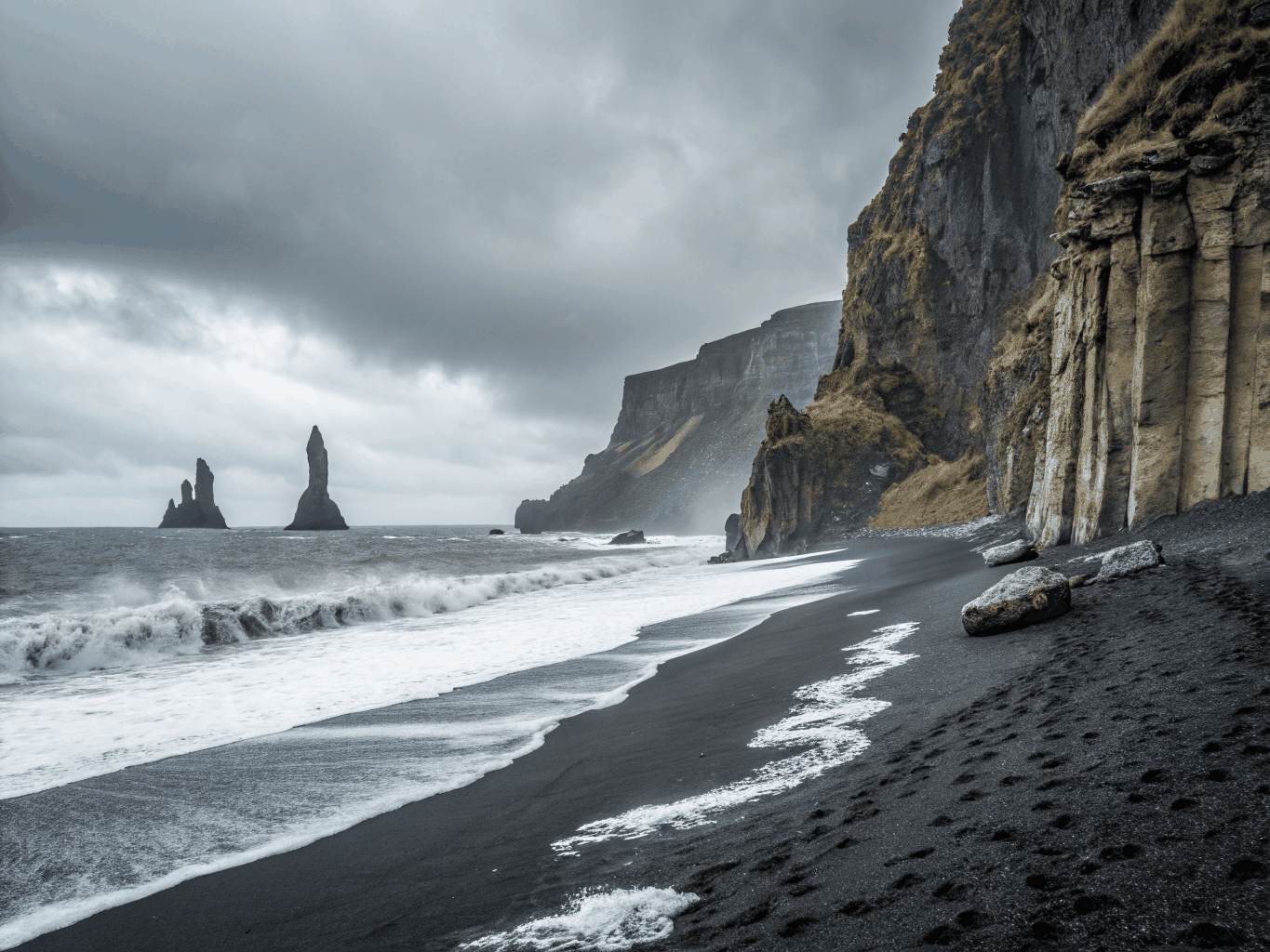 Basalt sea stacks emerging from Icelandic surf